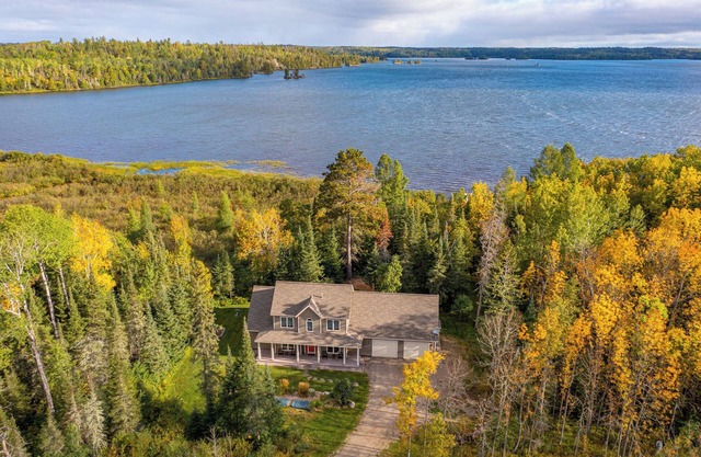 Superb 4-bedroom house on Shagawa Lake with dock, boat lift, and total comfort.