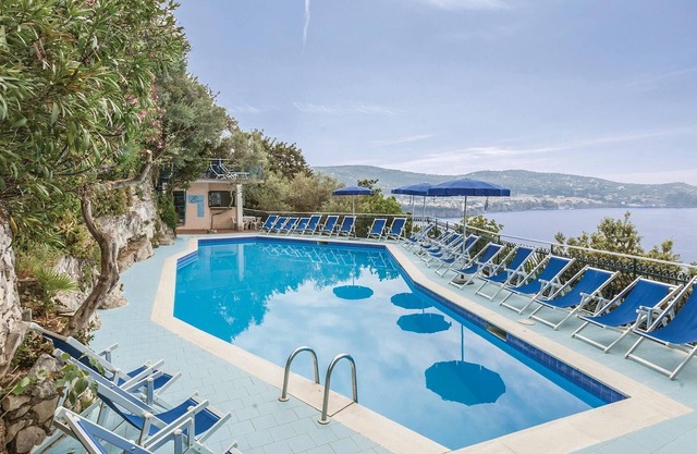 These bungalows are located in a vacation home complex directly above the sea, with panoramic views