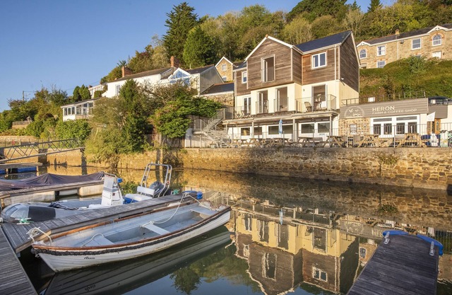 This holiday home is situated right on the water’s edge within the Malpas Marina