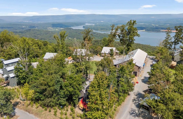 This is IT Cabin with a hot tub, fire pit, & indoor pool!