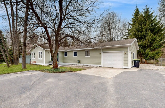 Tranquil Lakeview Retreat in Suttons Bay, with a private sauna, & large yard