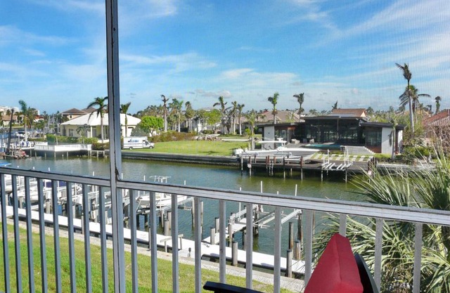 Tranquil waterfront condo with pool and steps to beach