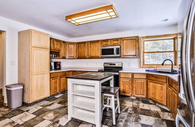 Tree-lined home with gas grill, firepit, & fireplace - walk to lake