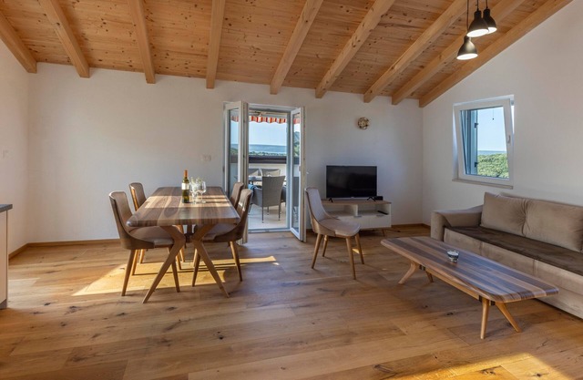 Two bedroom apartment with terrace and sea view Sveti Jakov, Lošinj (A-24153-a)