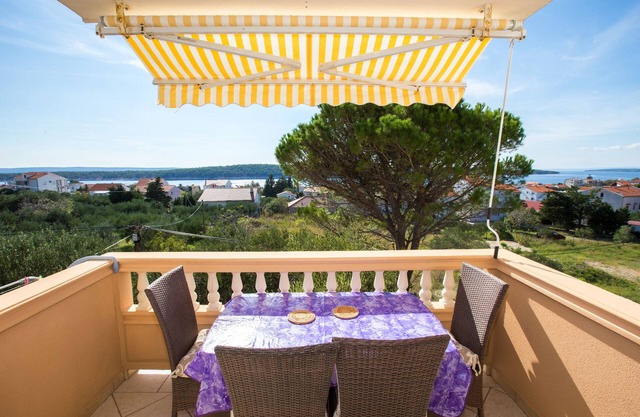 Two bedroom apartment with terrace and sea view Barbat, Rab (A-16245-b)