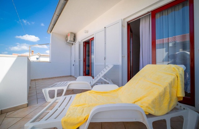 Two bedroom apartment with terrace and sea view Rab (A-24367-a)