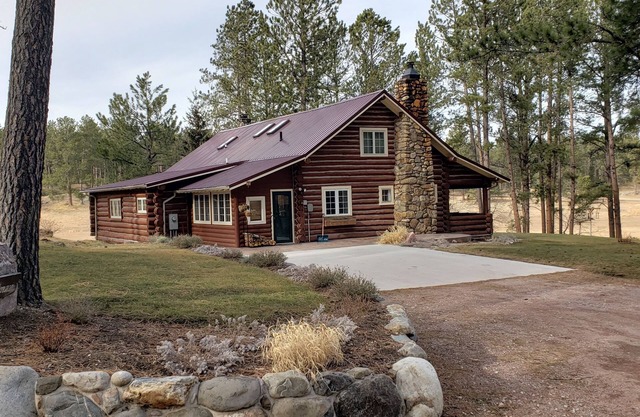 Two story authentic log construction home, built in 1936 with two fireplaces.