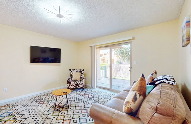 Updated condo in great location with private patio, outdoor pool, hot tub, W/D