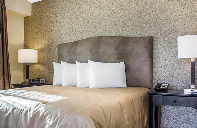 UpScale Resort with Outdoor Heated Pool with a waterslide and a poolside bar, tennis court and gym