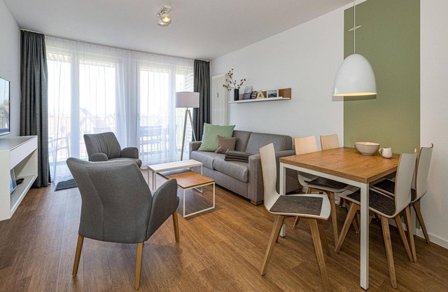 Vacation apartment near the North Sea with balcony, parking, use of swimming pool & sauna -