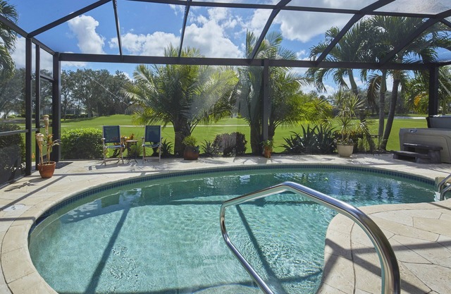 Villa on golf course with heated saltwater pool.n