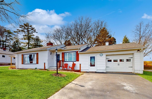 Waterfront home with stunning Owasco Lake view, dock, firepit & covered porch