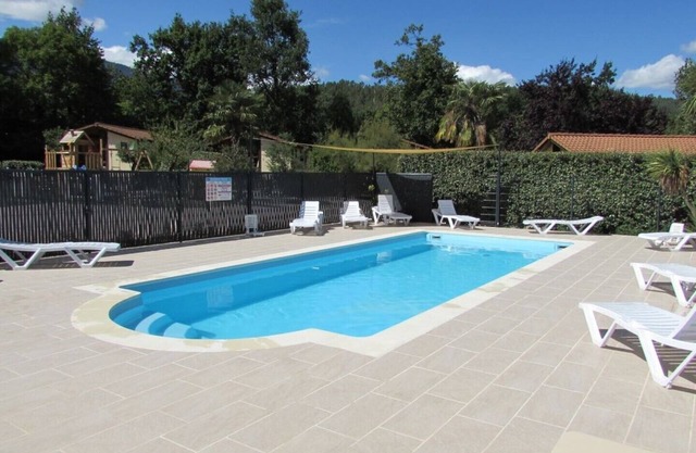 Wooden chalets in gite village with terrace, barbecue, swimming pool and air conditioning