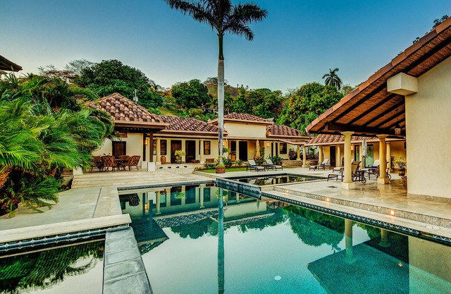 World Class Flamingo Beachfront Villa with 5 Poolside Bedroom Suites!