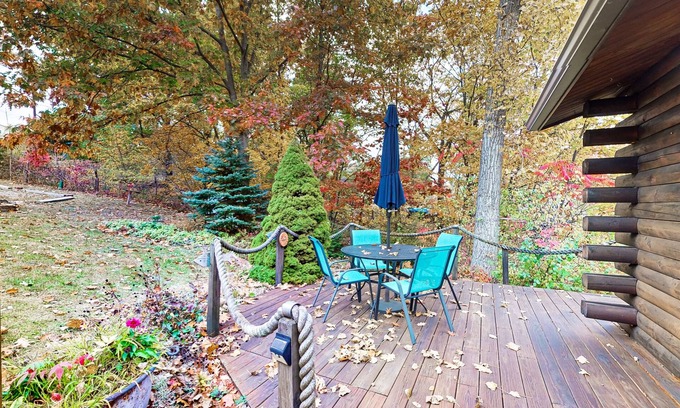 Valois House | 1-acre lakefront log cabin with dock, 50 ft water frontage, hot tub, & deck