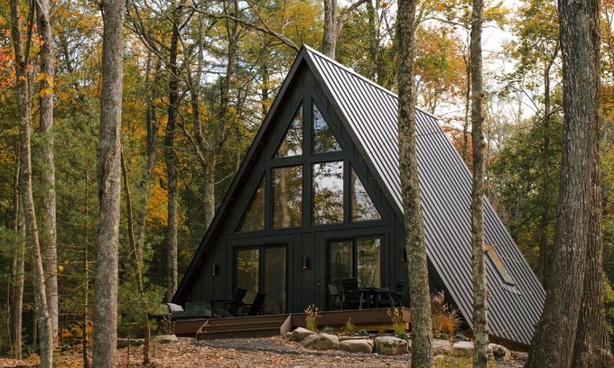 Town of Lumberland Cabin | A modern A-frame, nestled in the woods with relaxing outdoor spaces and firepit.