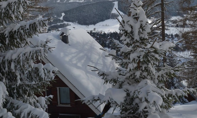 Les Lolettes Ski Chalet | Adorable chalet perched in the forest with breathtaking views of the ski area.