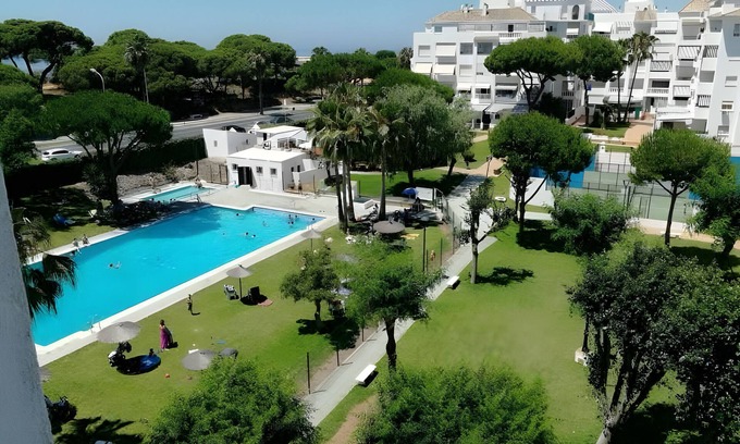 El Portil Apartment | Apartment 'El Portil Pinares' with Shared Pool, Private Terrace and Wi-Fi