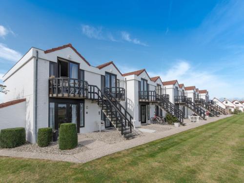 De Haan Apartment | Apartment Isabelle with parking and shared pool by Interhome