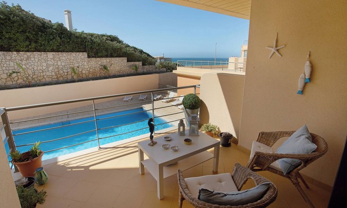 Atalaia Apartment | Apartment 'Praia Areia Branca' with Sea View, Shared Pool and Wi-Fi