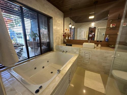 Nacoes House | Arthi - LINDO LOFT RECANTO DOS PASSARINHOS com HIDROMASSAGEM!