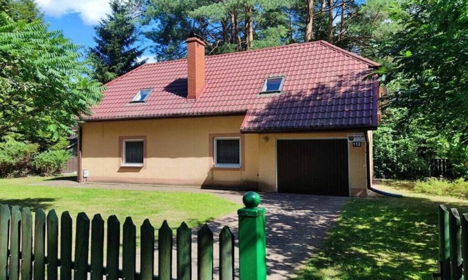 Spychowo House | at the lake with a boat