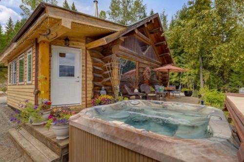 Central Okanagan Ski Chalet | Authentic lofted log cabin with hot tub