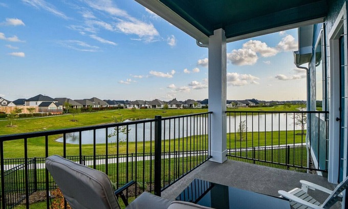 Iowa Colony House | Balcony with Serene Waterfront Views