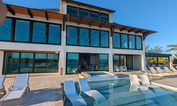 Jimmy Hill House | Beachfront estate home with private 70’ dock and 7500sq ft. of living space