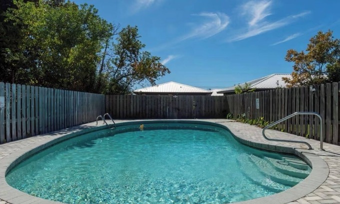 Highland City Apartment | Beachy Poolside Palm nestled between PCB, Mexico Beach and downtown PC.