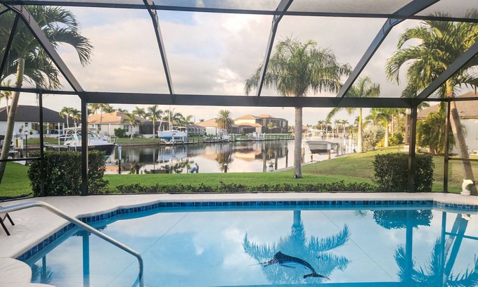 Burnt Store Isles House | Beautiful, waterfront home with amazing view, private heated pool, & central AC