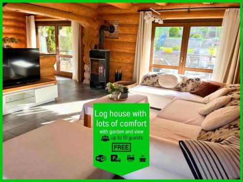 Laslea House | Blockhaus Malmkrog with garden, bright rooms, and an open kitchen