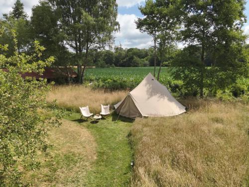 Vorden Other | Boutique tent bij Laaken op Zand unieke plek in het groen met luxe bed