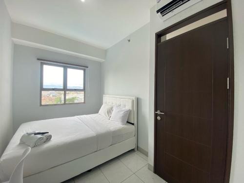 Cibaduyut Apartment | Bright and Relaxing 2BR Apartment at Mekarwangi Square Cibaduyut By Travelio