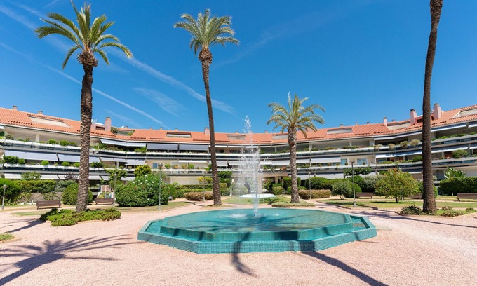 Passeig Maritim Apartment | Bright & Colourful Apt in Luxury Complex by Sea