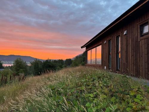 Aure House | Cabin at the end of Skardsøya towards the sea - boat