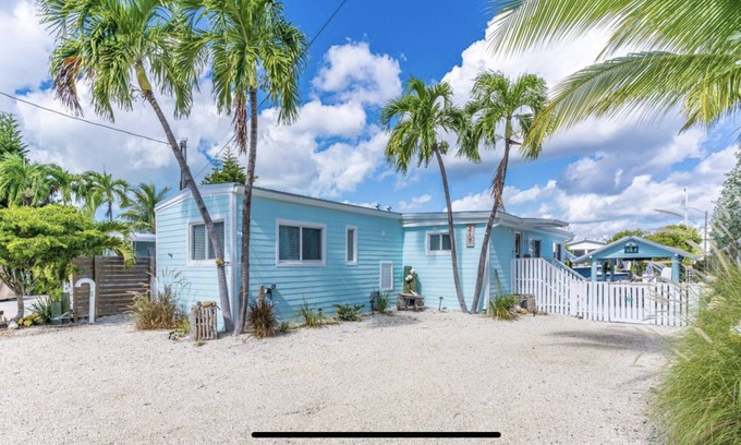 Key Largo Village House | Canal Front with Bay Access Home and private sandy beach.