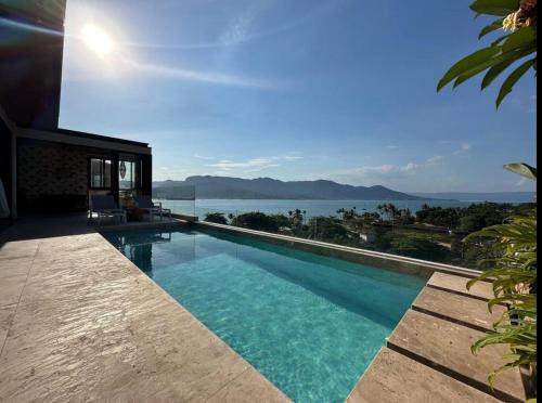 Itaguassu House | Casa com piscina aquecida, jacuzzi e 60 m da praia