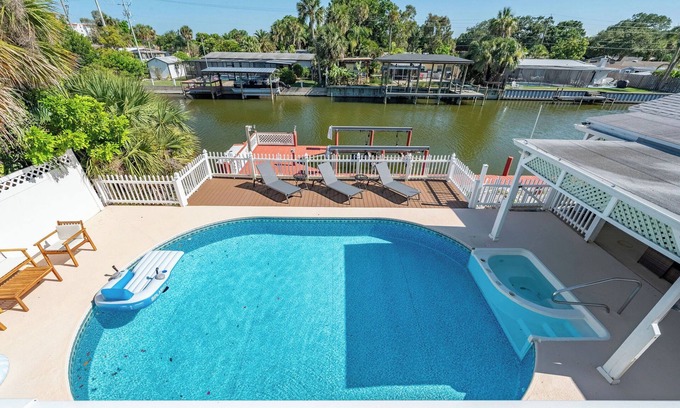 Hampton Homes House | Casa Las Olas - Waterfront Home with Heated Pool, Movie Theater & Arcade