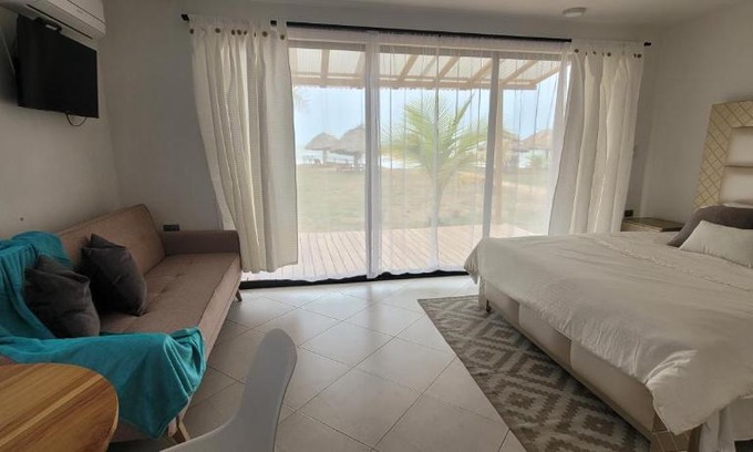 Monitos House | Casa Suite Palmar del viento FRENTE, FRENTE AL MAR by Amauna