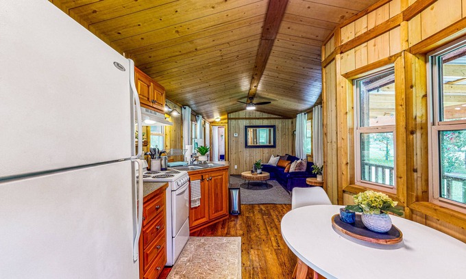 Waller Cabin | Cedar cabin with pretty pond, beach, swimming deck & tropical hut/bar