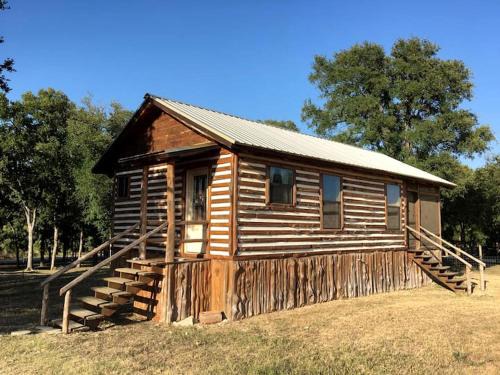 Prairie Lea House | Charming Log Cabin in Texas - Perfect Glamping Vacation on the San Marcos River near Kingsbury