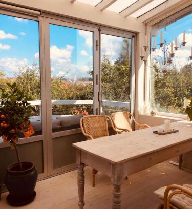 Randers Apartment | Charming sunroom with panorama view