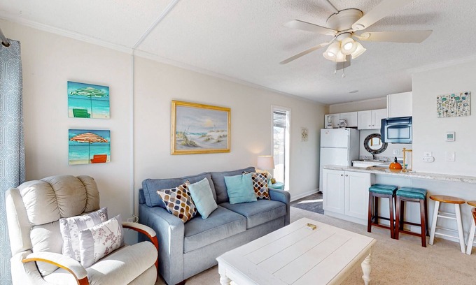 Sneads Ferry Condo | Cheerful beachfront condo with balcony, tennis court, & W/D - snowbird-friendly
