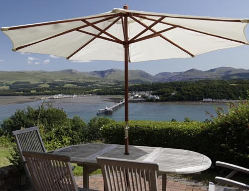 Menai Bridge House | Coed y Berclas cottage, private orchard with stunning views