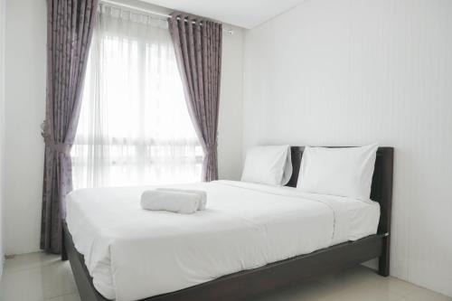 East Jakarta Apartment | Comfort 1BR Apartment with Study Room at Woodland Park Residence By Travelio