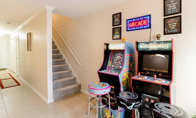 Peachtree Corners Apartment | Cozy Family Retreat with Arcade, Grill, Waffle Bar & Firepit
