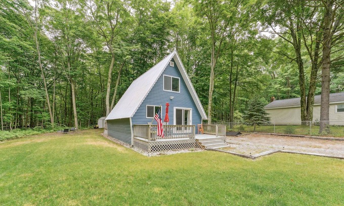 Ludington Cabin | Cozy Michigan Escape w/ Deck, Fire Pit & Grill!