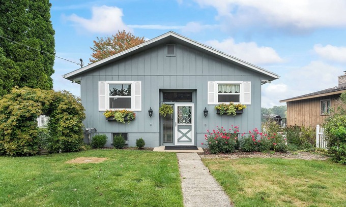 Kendall Cottage | Cozy Spotless Lake Cottage- Flowers Galore, Sandy Beach, Gorgeous Sunsets