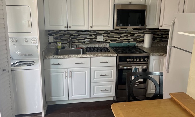 Sunset Beach Apartment | Cozy Sunset Beach Studio with Peek A Boo Ocean Views (Second Story/Dog Friendly)